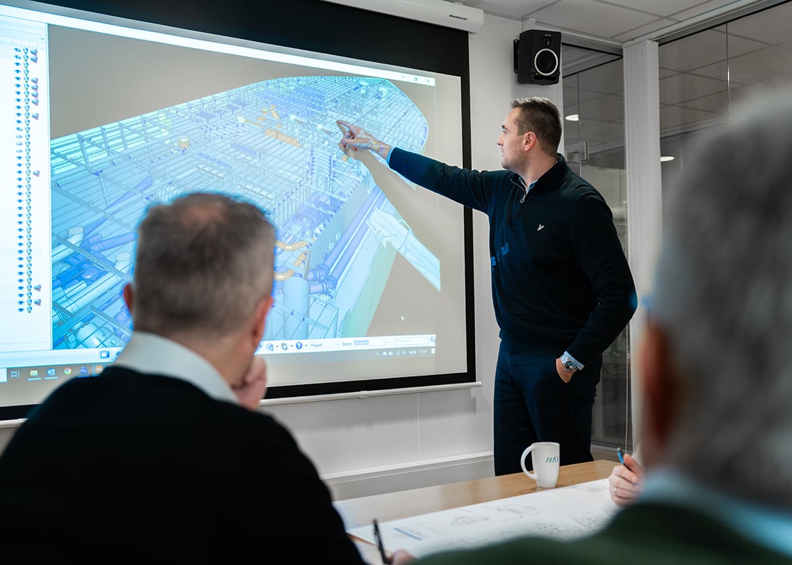 HAV Design-man-presenting-meeting